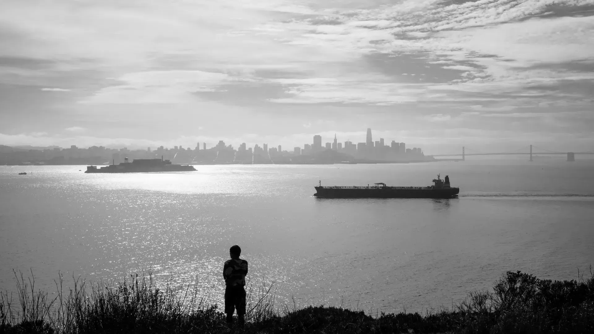 A visitor enjoys the wide views from Angel Island