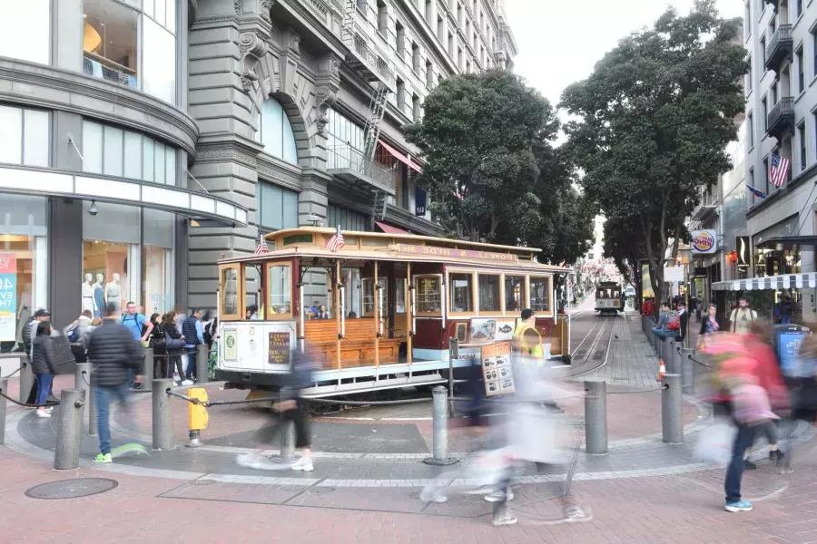 A San Francisco cable car is manually turned at the Powell Cable Car Turnaround.